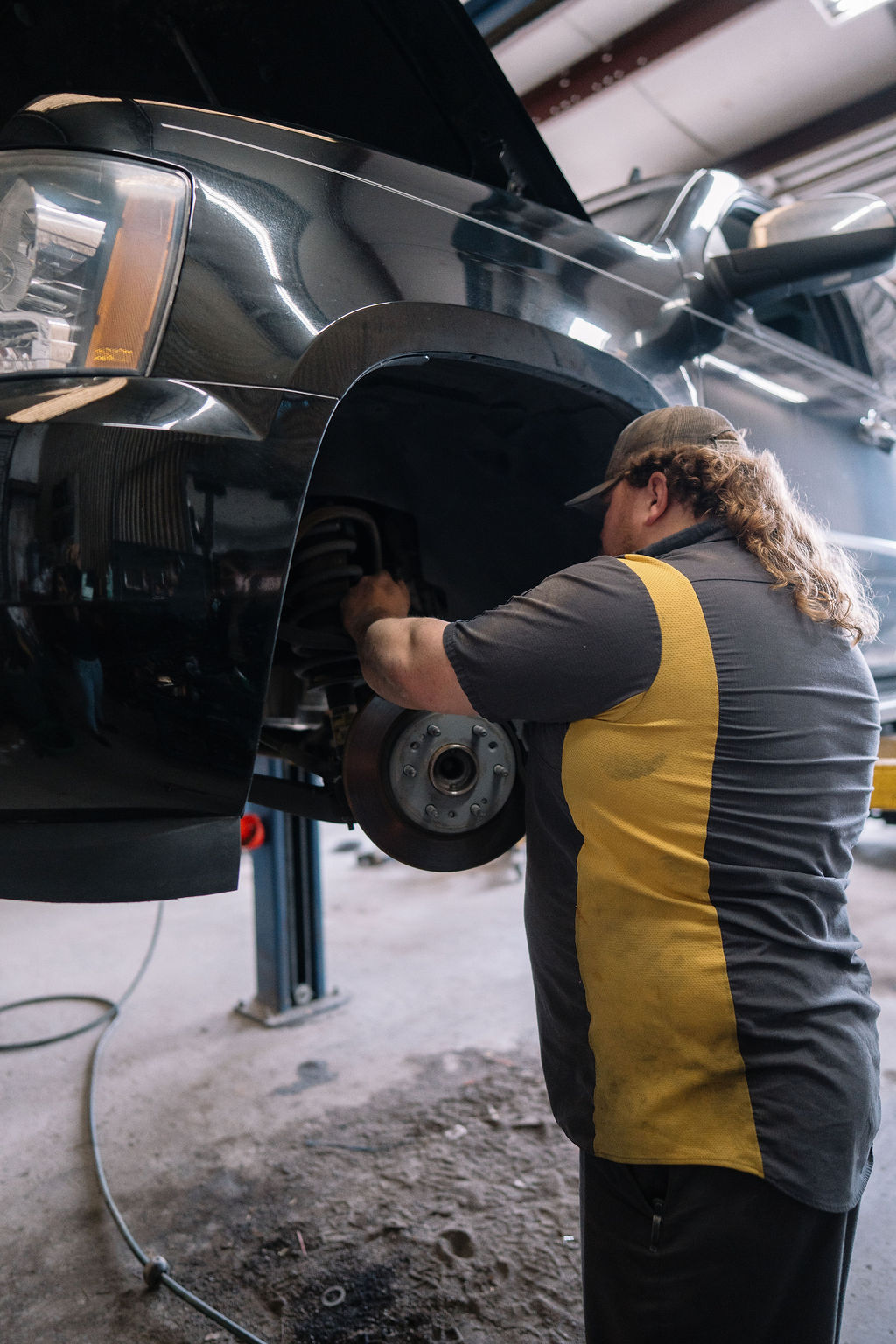 Mechanic performing brake repair at our Grovetown, Georgia auto shop